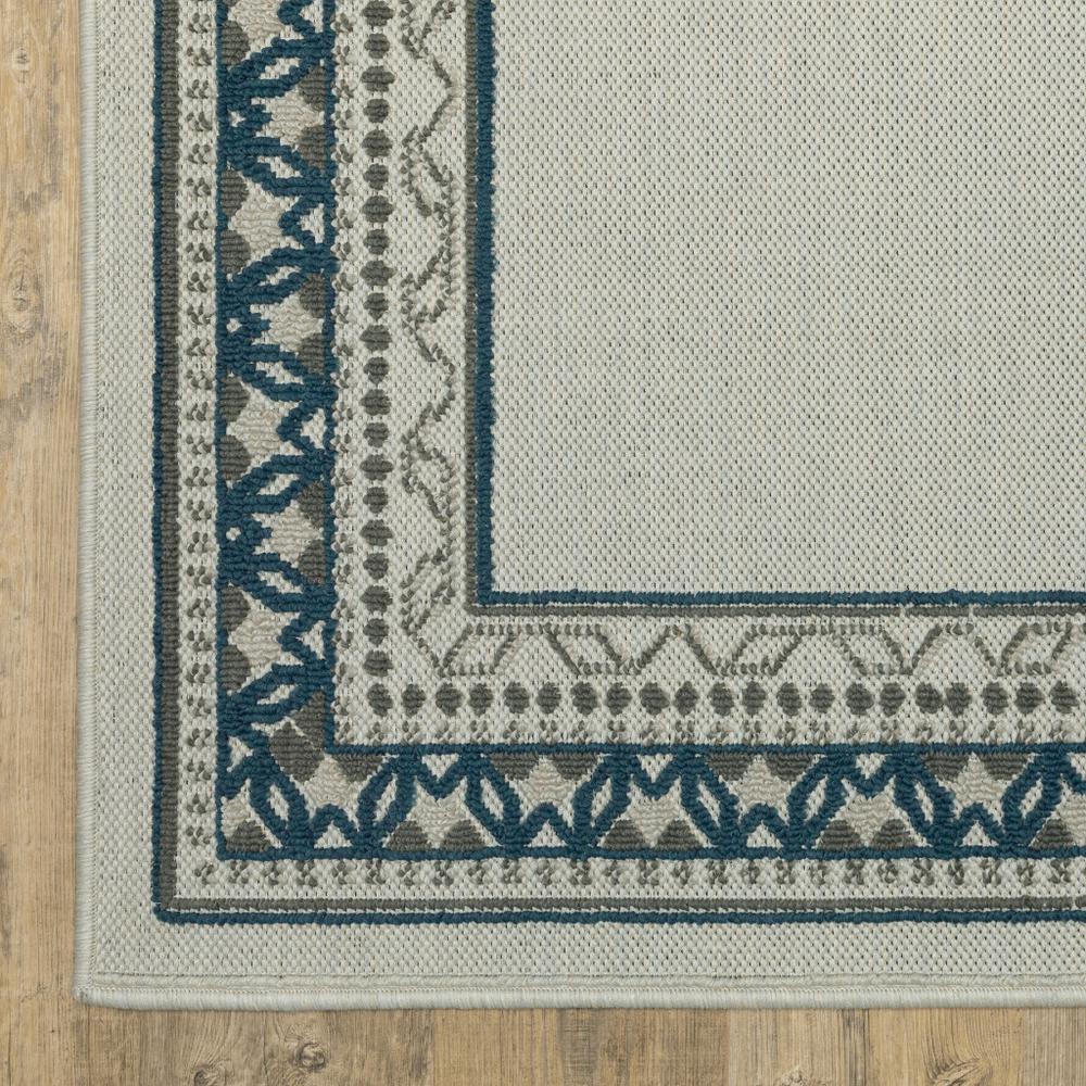2' X 4' Blue and Beige Stain Resistant Indoor Outdoor Area Rug. Picture 1