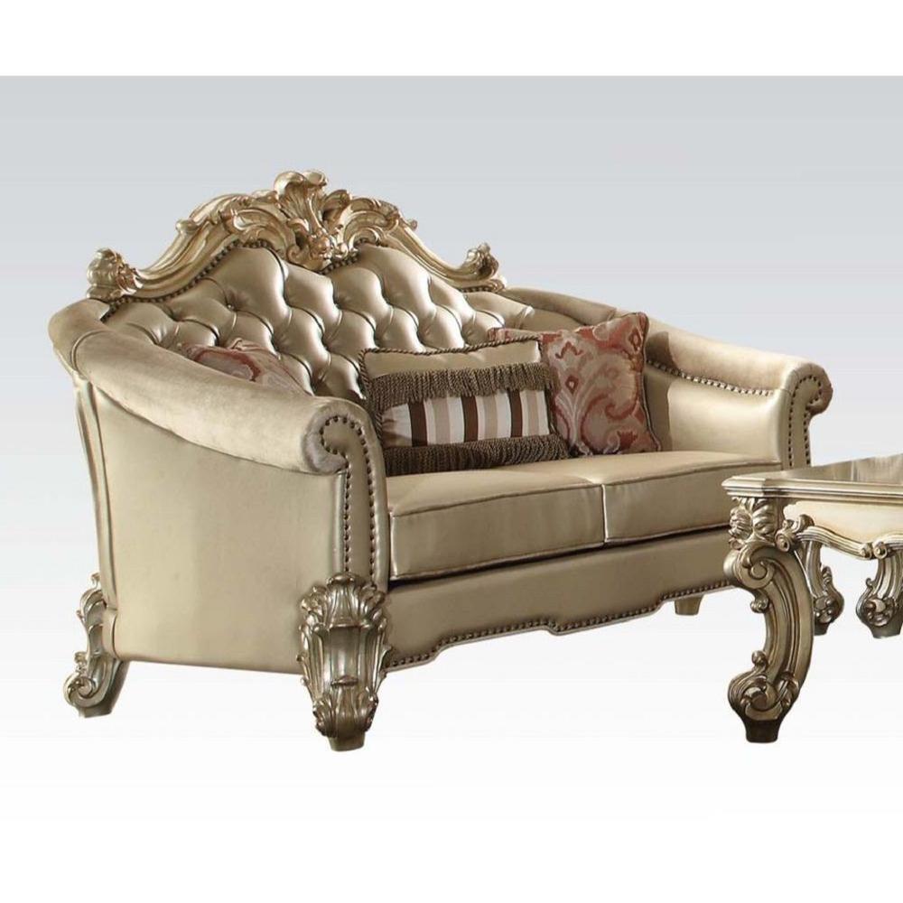 67" Bone And Gold Faux Leather Love Seat And Toss Pillows. Picture 1