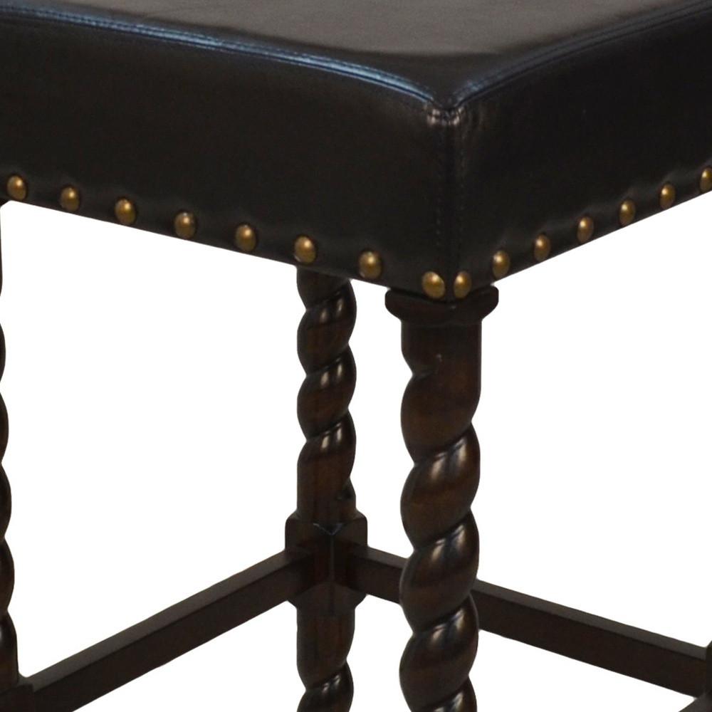 30" Black Faux Leather And Solid Wood Backless Bar Height Chair With Footrest. Picture 3