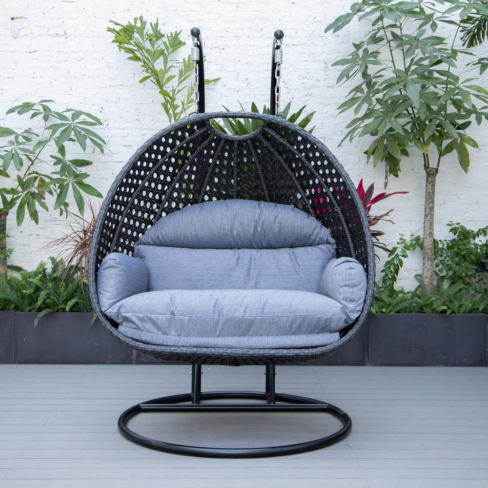 LeisureMod MendozaWicker Hanging 2 person Egg Swing Chair in Charcoal Blue. Picture 4