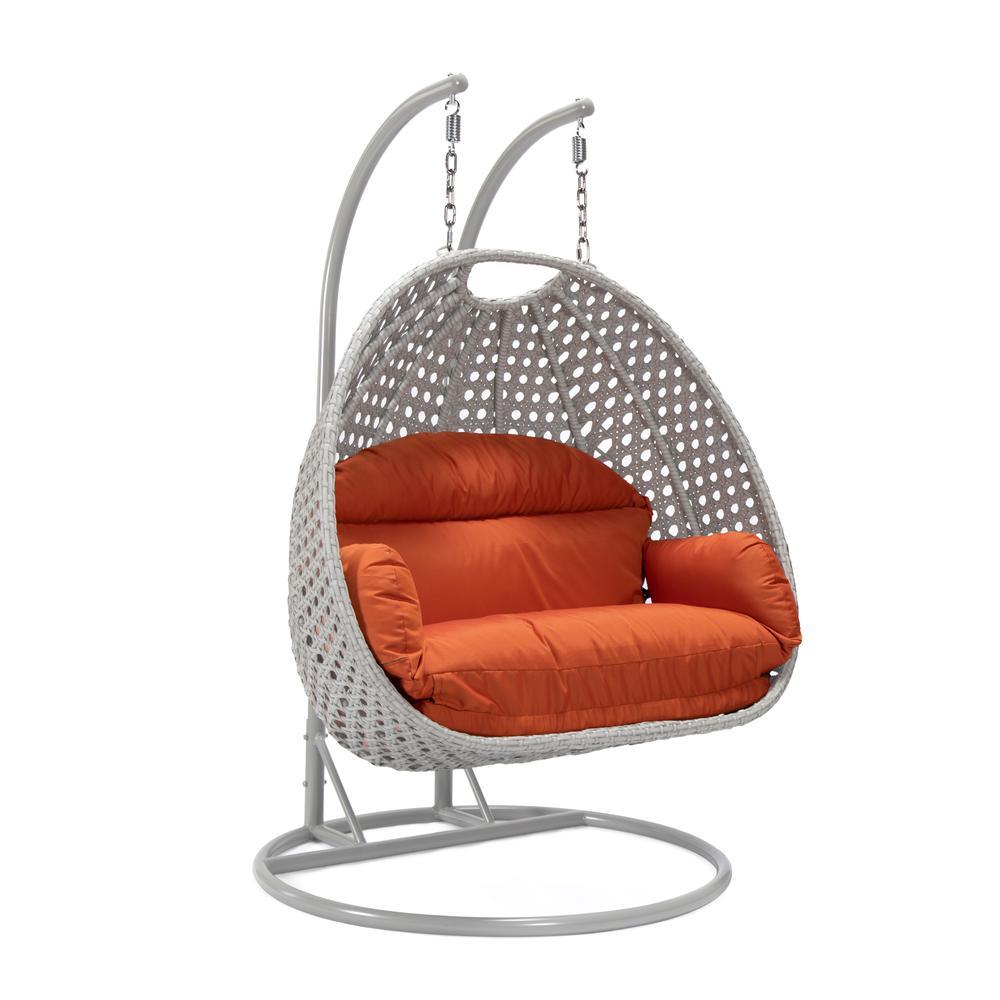 LeisureMod Wicker Hanging 2 person Egg Swing Chair in Orange. Picture 1