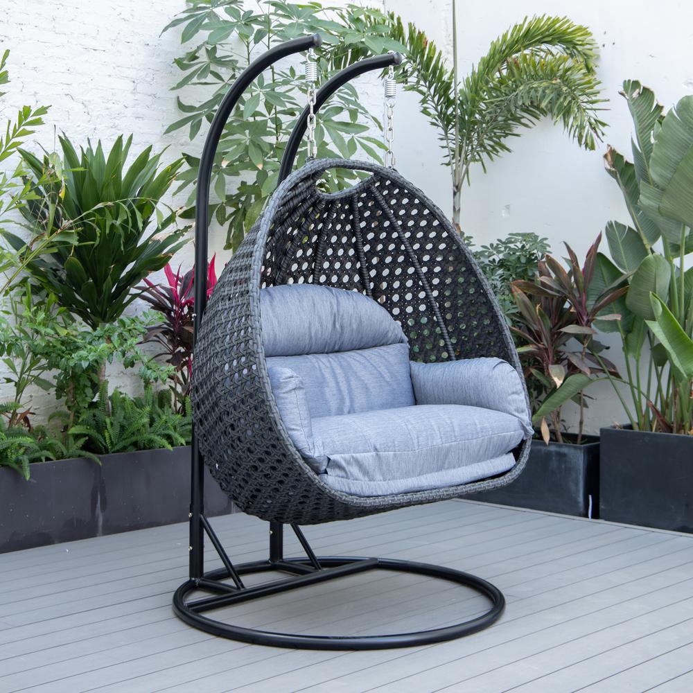 LeisureMod MendozaWicker Hanging 2 person Egg Swing Chair in Charcoal Blue. Picture 3