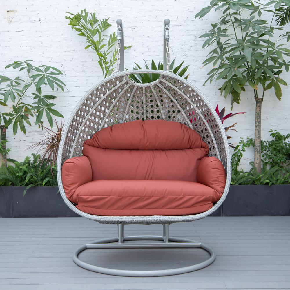 LeisureMod Wicker Hanging 2 person Egg Swing Chair in Cherry. Picture 3