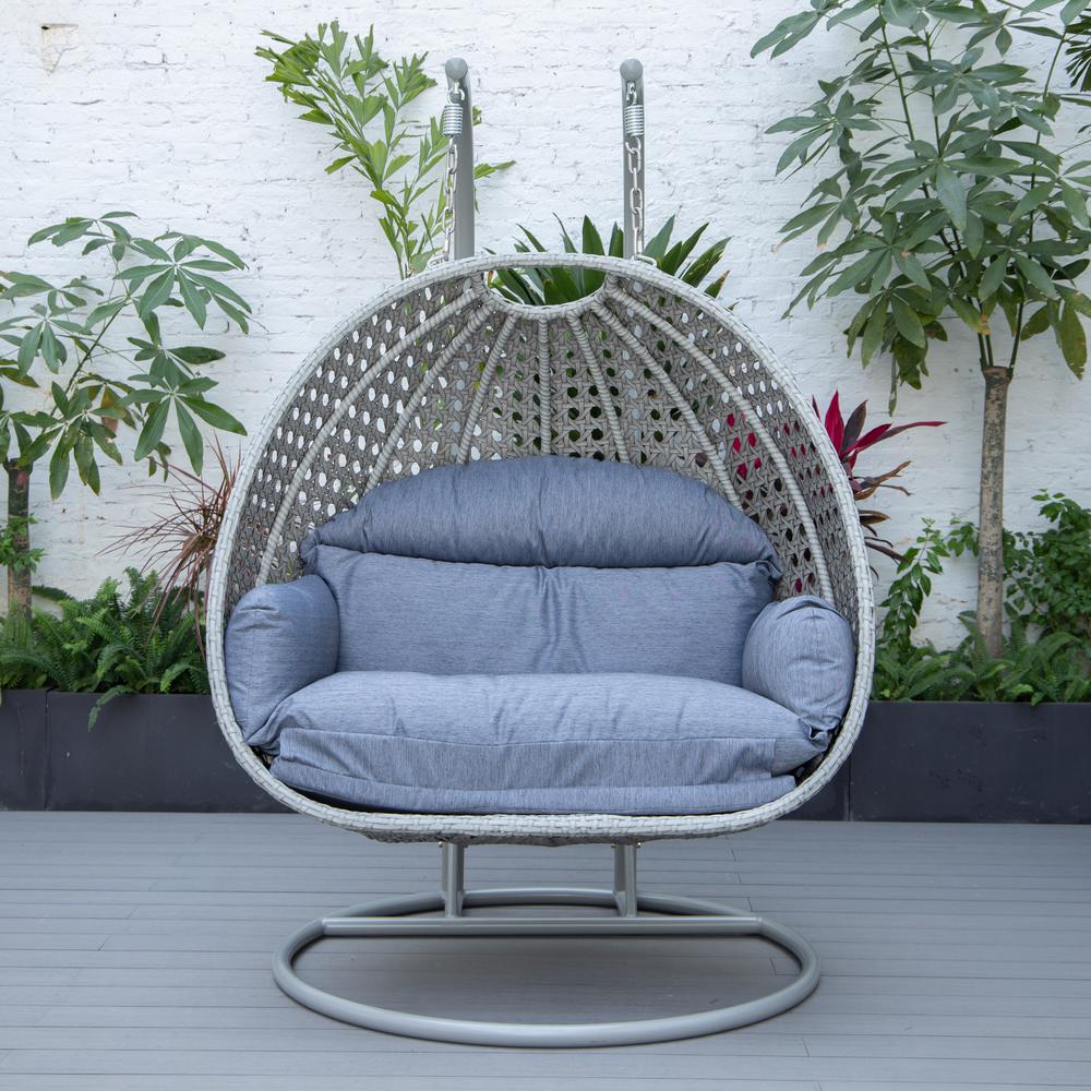 LeisureMod Wicker Hanging 2 person Egg Swing Chair in Charcoal Blue. Picture 4