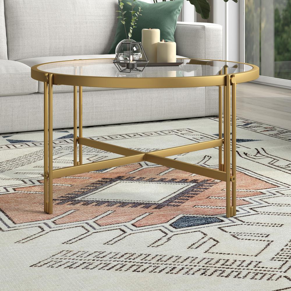 Inez 32" Wide Round Coffee Table in Brass. Picture 2