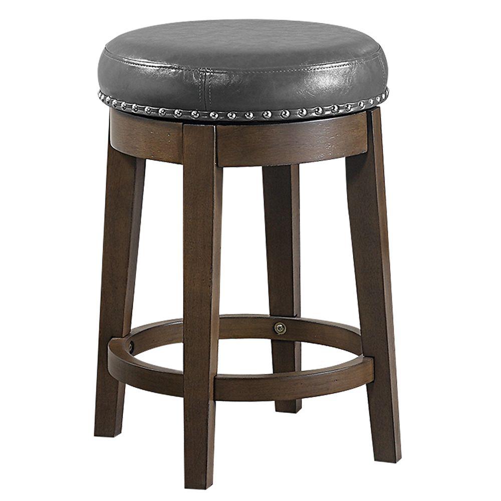 Poundex 24" Round Swivel Counter Stool in Gray Faux Leather (Set of 2), 18" Dia x 24" H, Package Weight 44. Picture 1