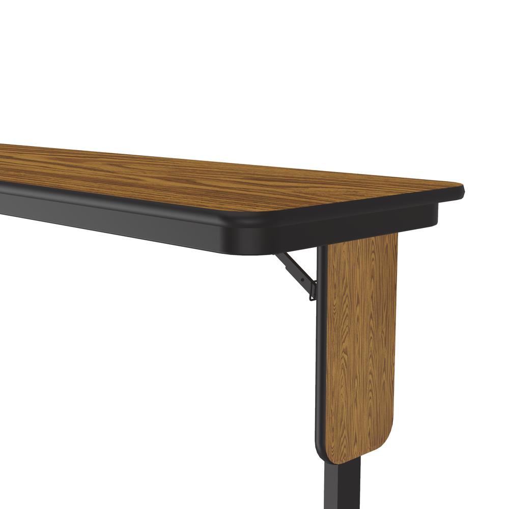 Deluxe High-Pressure Folding Seminar Table with Panel Leg, 18x72" RECTANGULAR MED OAK BLACK. Picture 3