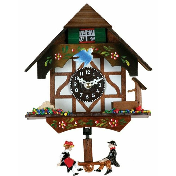 Quartz Novelty Clock - German Chalet with Bird & Well. The main picture.