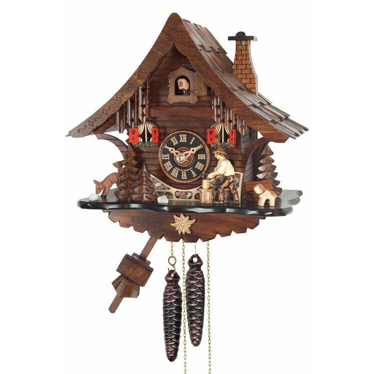 One Day Cuckoo Clock Cottage with Man Chopping Wood. Picture 1