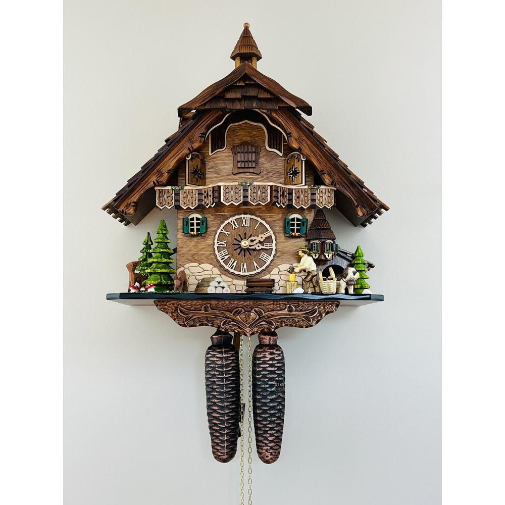 Eight Day Cuckoo Clock  - Cottage, Turret, Man Chopping Wood. Picture 1