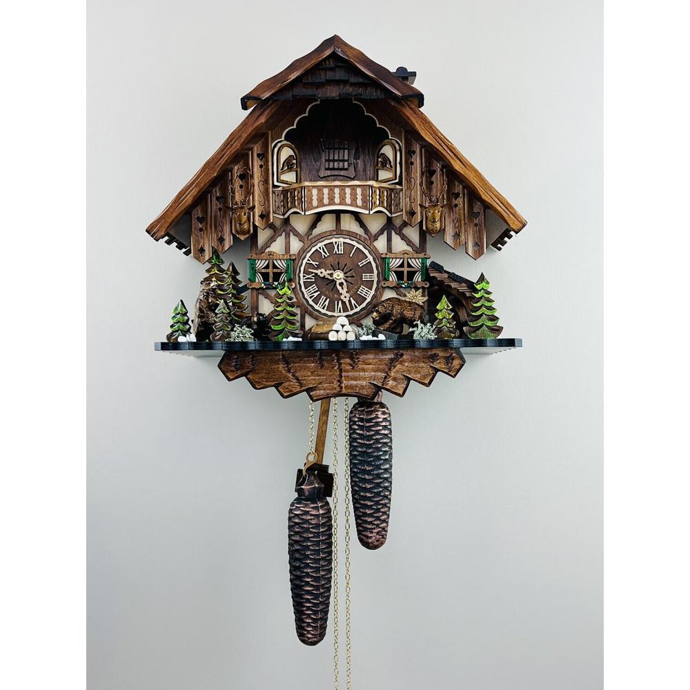 Eight Day Hunter's Cuckoo Clock with Hand-carved Maple Leaves, Rifles, and Buck. Picture 1
