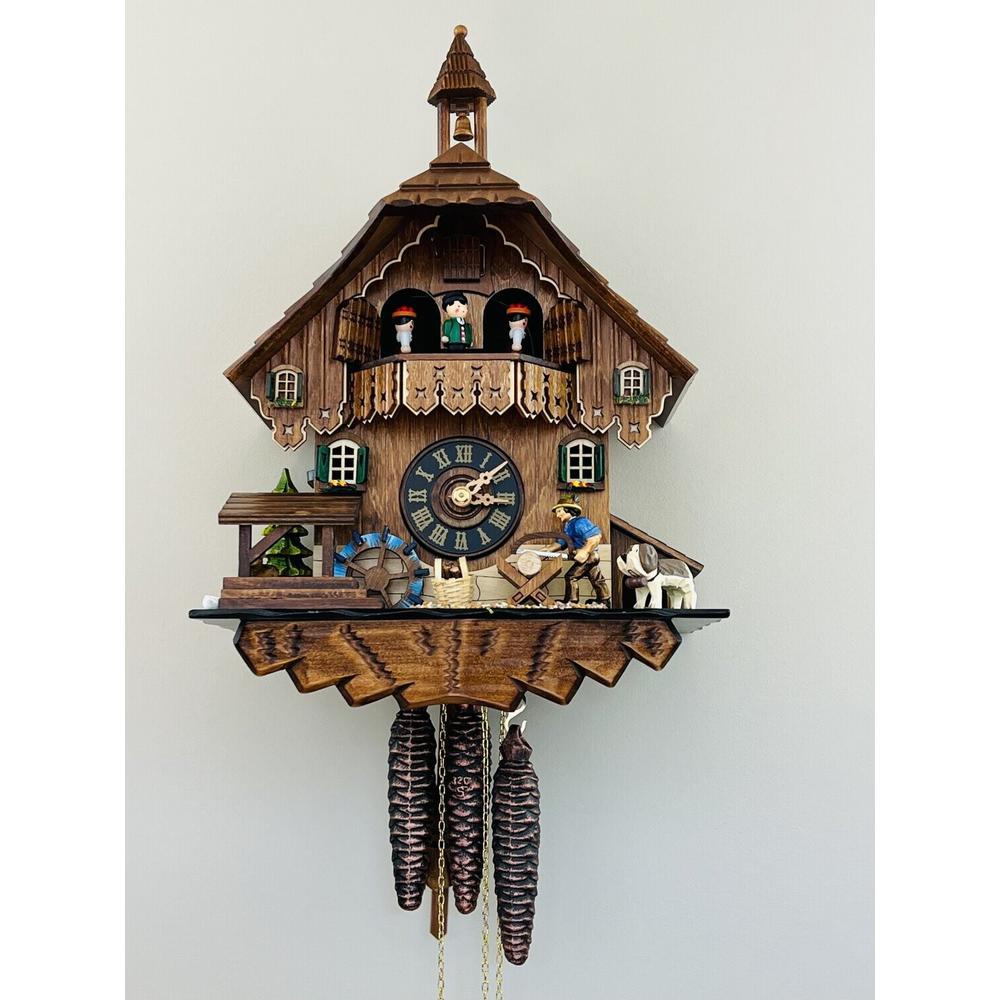 One Day Musical Cuckoo Clock Cottage with Man Sawing Wood. Picture 1