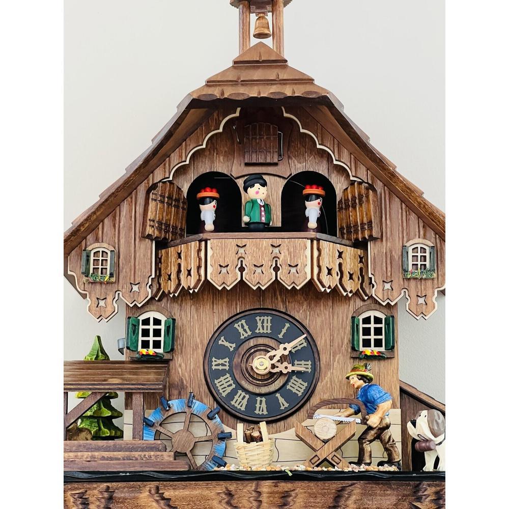 One Day Musical Cuckoo Clock Cottage with Man Sawing Wood. Picture 3