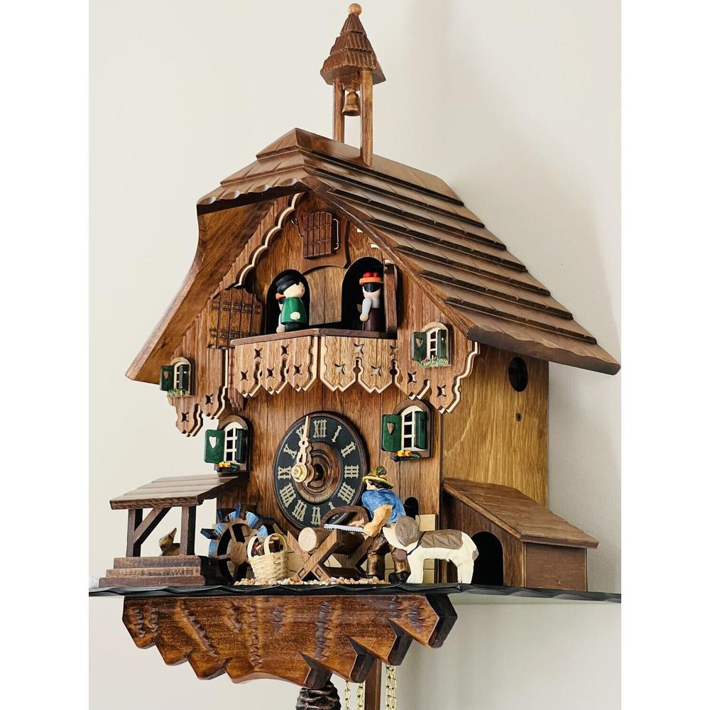 One Day Musical Cuckoo Clock Cottage with Man Sawing Wood. Picture 2