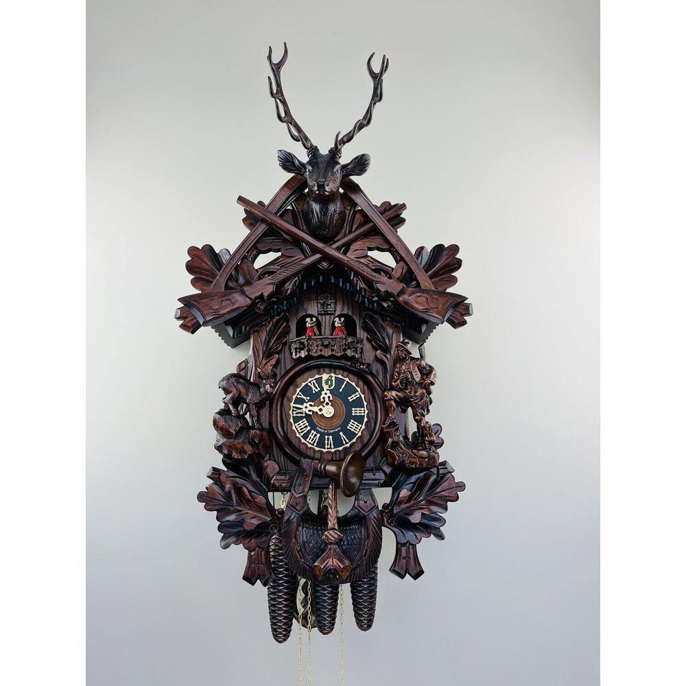 Eight Day Musical Cuckoo Clock Hunter's Style with Carved Woodsman and Stag. Picture 1