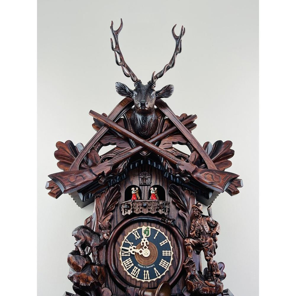 Eight Day Musical Cuckoo Clock Hunter's Style with Carved Woodsman and Stag. Picture 2