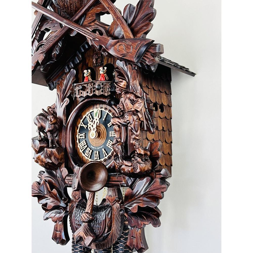 Eight Day Musical Cuckoo Clock Hunter's Style with Carved Woodsman and Stag. Picture 5