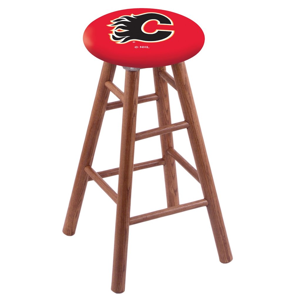Oak Bar Stool in Medium Finish with Calgary Flames Seat. Picture 1