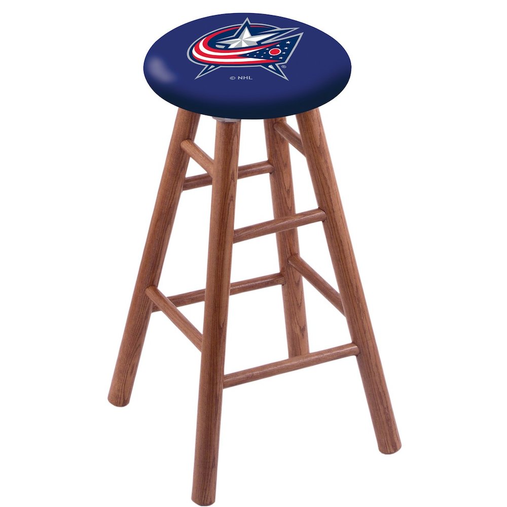 Oak Extra Tall Bar Stool in Medium Finish with Columbus Blue Jackets Seat. Picture 1