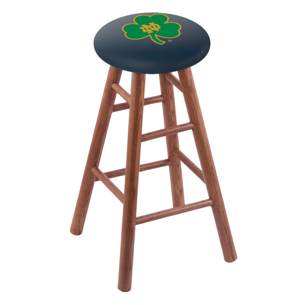 Oak Extra Tall Bar Stool in Medium Finish with Notre Dame (Shamrock) Seat. Picture 1