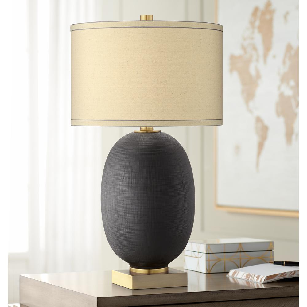 Table lamp Poly and metal in black and gold. Picture 2