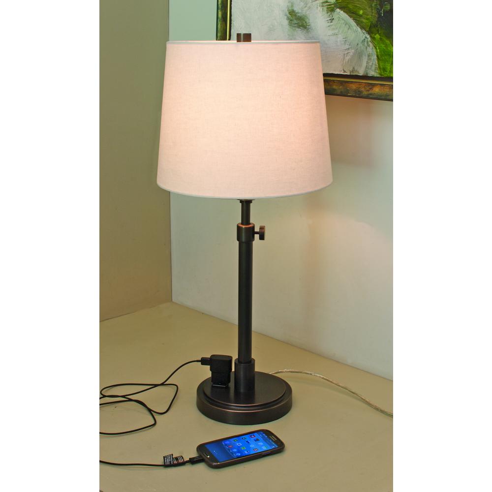 Townhouse Adjustable Table Lamp in Oil Rubbed Bronze with Convenience Outlet. Picture 1