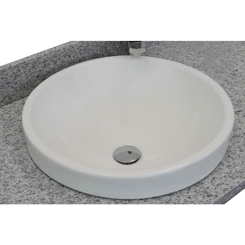 31 Gray granite top with round sink. Picture 1