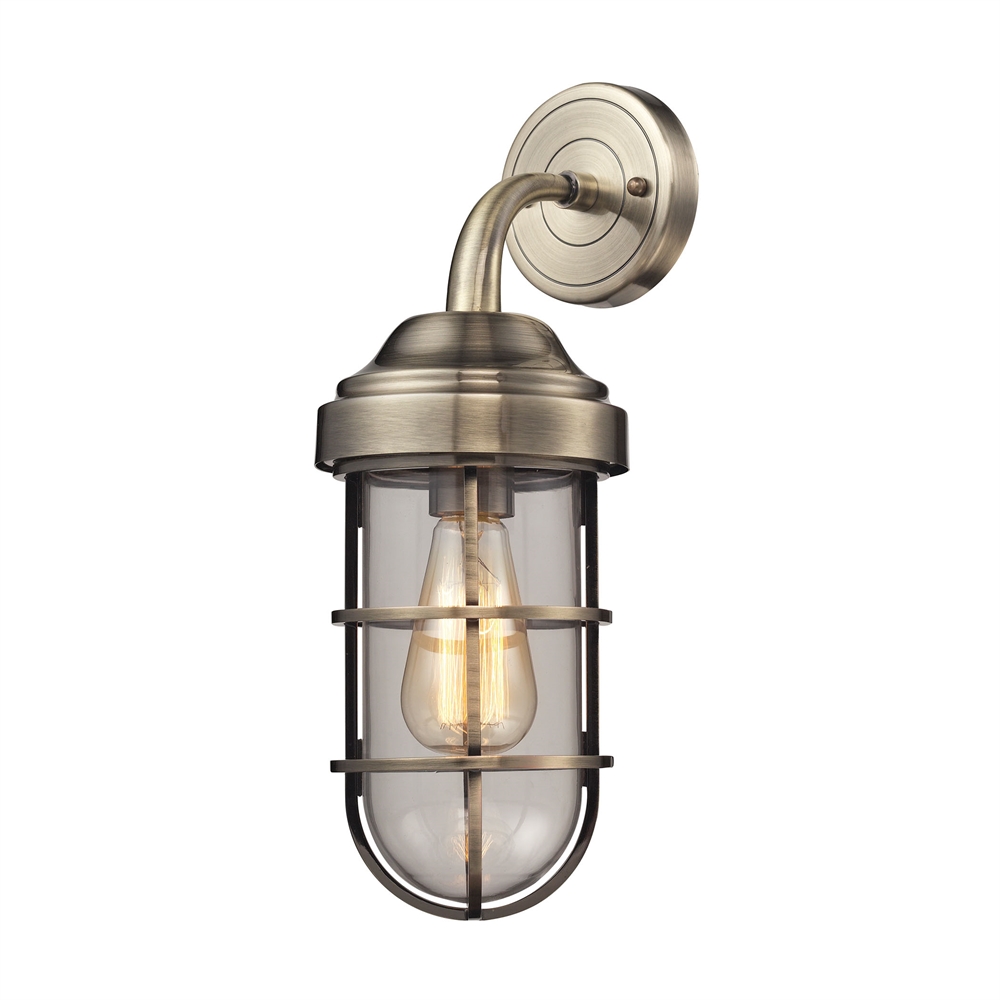Seaport 1 Light Wall Sconce In Antique Brass And Clear Glass. Picture 1