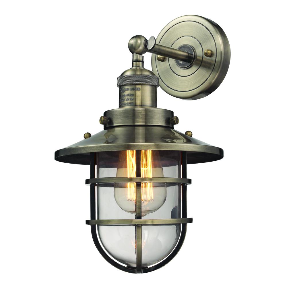 Seaport 1 Light Sconce In Antique Brass And Clear Glass. Picture 1
