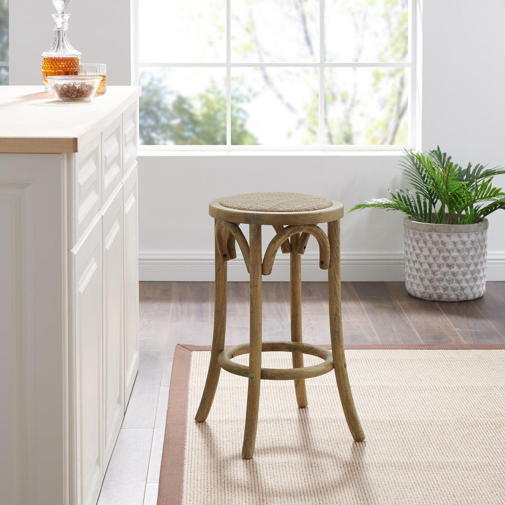 Rae Rattan Seat Backless Counter Stool. Picture 1