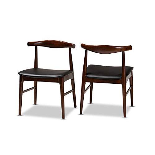 Baxton Studio Eira Mid-Century Modern Black Faux Leather Upholstered Walnut Finished Wood Dining Chair. The main picture.