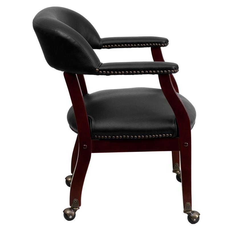 Black Vinyl Luxurious Conference Chair with Accent Nail Trim and Casters. Picture 2