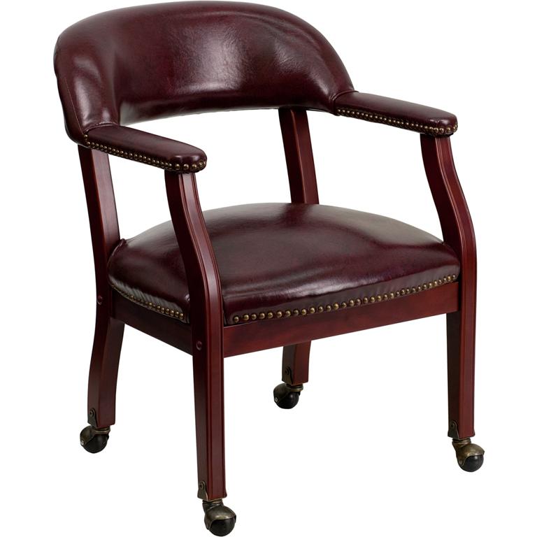 Oxblood Vinyl Luxurious Conference Chair with Accent Nail Trim and Casters. The main picture.
