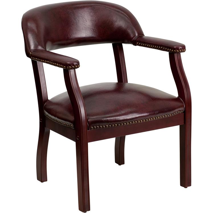 Oxblood Vinyl Luxurious Conference Chair with Accent Nail Trim. Picture 1