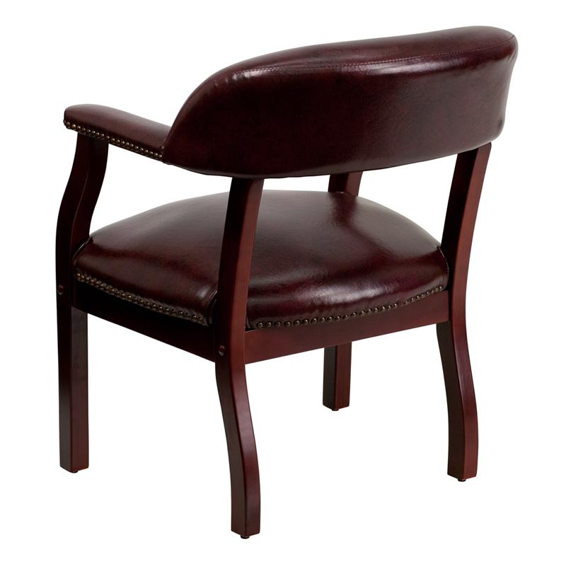 Oxblood Vinyl Luxurious Conference Chair with Accent Nail Trim. Picture 3