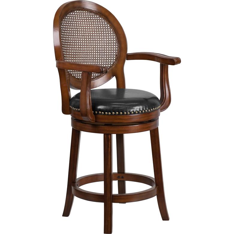26'' High Expresso Wood Counter Height Stool with Arms, Woven Rattan Back and Black LeatherSoft Swivel Seat. Picture 1